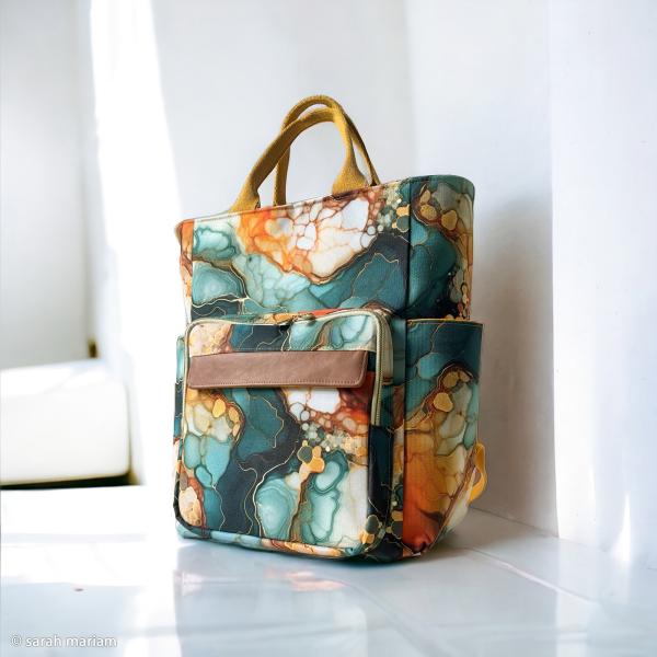 Outdoorstoff Flowing Bloom Marbels in petrol/orange Töne by Swafing von Sarah Mariam